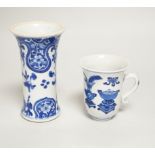 A Chinese blue and white small vase and a similar ‘Hundred Antiques’ chocolate cup, both Kangxi