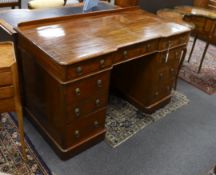A Victorian mahogany Heal & Son, London inverse breakfront pedestal desk, width 122cm, depth 59cm,