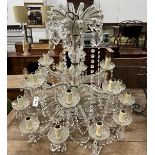 A moulded glass eighteen branch electrolier, hung circular and pear shaped faceted drops, height