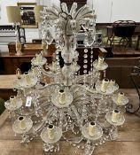 A moulded glass eighteen branch electrolier, hung circular and pear shaped faceted drops, height