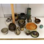 A large collection of mixed studio pottery vases, bowls and dishes,