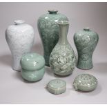 Seven pieces of Korean celadon glazed ceramics including four vases decorated with cranes amongst