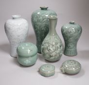 Seven pieces of Korean celadon glazed ceramics including four vases decorated with cranes amongst