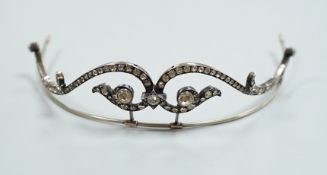 A 19th century, white and yellow metal paste cluster set tiara, width 13cm, the central stone with