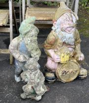 Two reconstituted stone and fibreglass gnome garden ornaments, larger height 65cm together with a