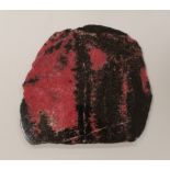A pink and black quartzite? section. 18cm