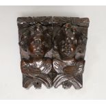 A pair of Italian carved walnut putti corbels, 18cm high