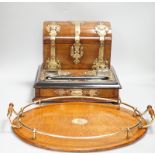 A Victorian walnut brass mounted dome topped stationery box and ink stand and an oval oak and a