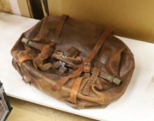 A late 19th early 20th century large brown leather Gladstone bag with leather straps, top frame 62cm