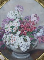 Alix Jennings (1884-1980), oil on board, Still life of flowers in a vase, oval, 50 x 44cm