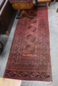 An antique Tekke rug 138cm x 66cm and an Afghan runner 280cm x 104cm.