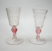 Two similar 18th century Continental goblets, both with elongated bowls heavily engraved with