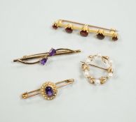 A 15ct and graduated five stone garnet set bar brooch, 48mm, a similar amethyst and seed pearl