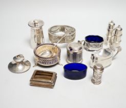 Eight assorted silver condiments, including a George III oval salt and four other items including