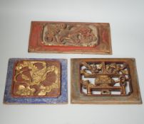 Three Chinese gilded and lacquered wood panels, early 20th century, longest 31cm