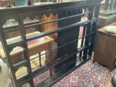 A mid 18th century oak plate rack width 183cm, height 131cm.