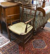 A William Morris style beech and fruitwood rush seated elbow chair
