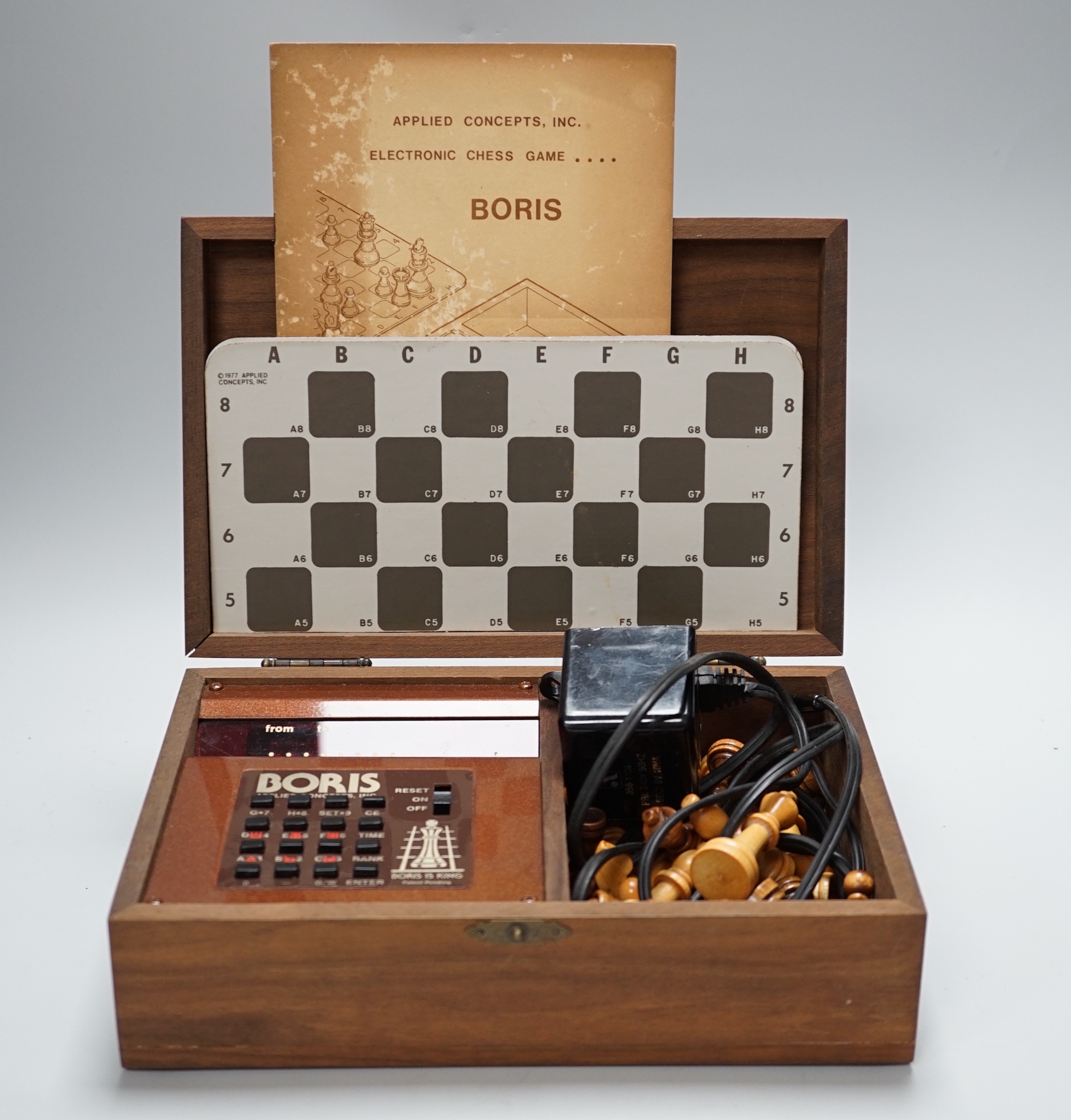 A 1970's Boris electronic chess set by Applied Concepts Inc., in a walnut case, 25.5cm x 17cm