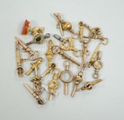 Twenty assorted mainly 19th century yellow metal small watch keys, including trade insignia,
