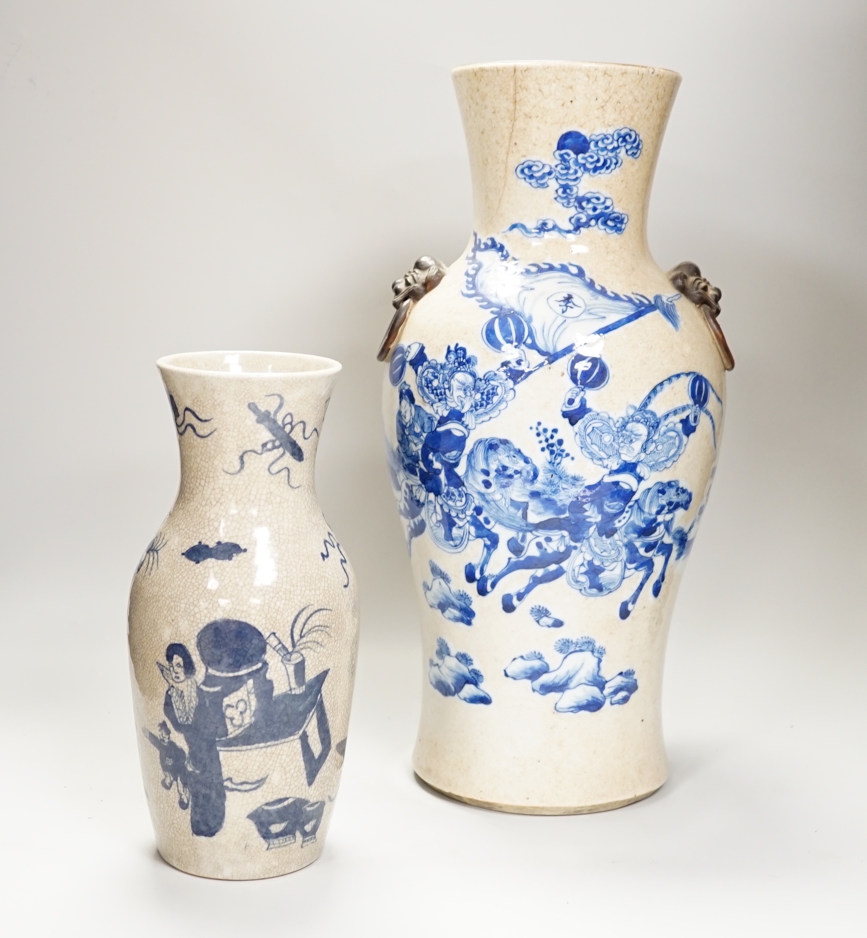An early 20th century Chinese crackle glaze blue and white vase, 44cm and a later smaller vase