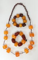 Three assorted amber items