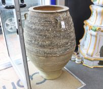 A Greek earthenware oil jar, height 103cm