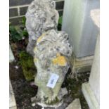 A pair of reconstituted stone seated lion garden ornaments, height 52cm