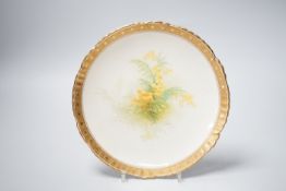 A Minton plate with yellow flowers and gilt border, 22cm