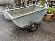 A vintage galvanised feed barrow, length 136cm, depth 64cm, height 72cm