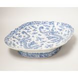 A 19th century Chinese blue and white ‘dragon’ lozenge shaped dish, 39cm