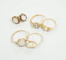 Two 18ct and white opal set rings, one with diamonds, gross 6.2 grams, a 14ct and white opal ring, a