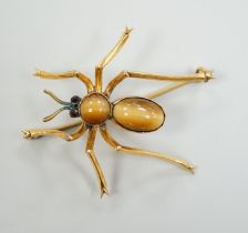 A yellow metal, tiger's eye quartz and gem set spider brooch, 41mm, gross weight 6.1 grams.