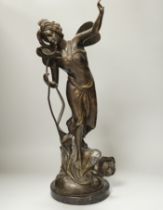 An Art Nouveau style fairy on a black marble base, 63.5cm high