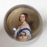 A Queen Victoria reverse decorated glass paperweight, approximately 7.5cm diameter