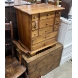 A small Victorian pine trunk, width 66cm, depth 44cm, height 47cm and a modern hardwood drawer unit