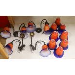 Four two branch metal wall lights with orange and blue glass shades and a set of six matching