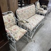 A painted wrought iron upholstered three piece suite, settee length 130cm, width 56cm, height 83cm