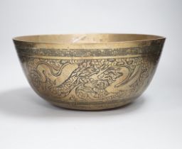 A Chinese brass ‘dragon’ engraved bowl, early 20th century, 33cm diameter