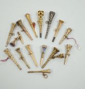 Fifteen assorted 19th century mainly yellow metal overlaid and gem set watch keys, including