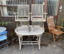 A weathered teak garden table, length 121cm, depth 89cm, height 75cm, and four folding elbow chairs