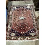 A North West Persian red ground rug, 151 x 105cm
