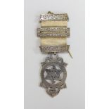 A boxed Masonic silver medal