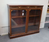 An Edwardian marquetry inlaid mahogany bookcase, bears Edwards & Roberts ivorine plaque, width