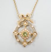 An Edwardian yellow metal, peridot and seed pearl cluster set pendant necklace, overall 55cm,