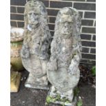 A pair of reconstituted stone heraldic lion garden ornaments, height 78cm