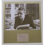 A framed photograph of T.S. Eliot with autograph