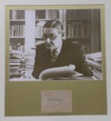 A framed photograph of T.S. Eliot with autograph