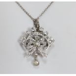 An early 20th century white metal, millegrain set diamond and split pearl cluster set drop