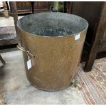 A large Victorian circular hammered copper cauldron with brass spigot, diameter 52cm, height 52cm