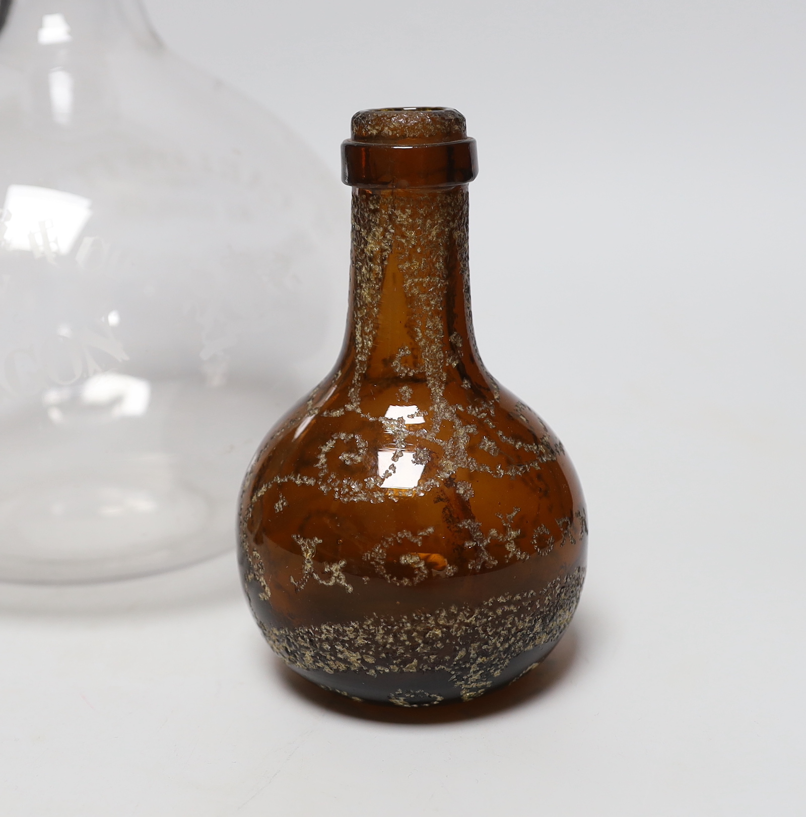 A large engraved, “Max Greger & Co London Wine Flagon”, a small amber glass bottle 1891 and a - Image 3 of 4